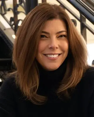 Therapist, Casey K Boniface, smiling with warmth and approachability, reflecting a safe and supportive counseling environment at Wise Mind Counseling.