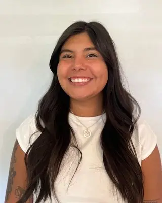 Therapist, Christine Stiebel, offering a friendly, professional smile that reflects emotional safety, support, and connection at Wise Mind Counseling.